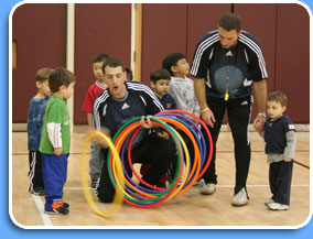 Alex with kids, playing with hoops